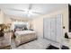 Comfortable bedroom with neutral color palette and tile flooring at 34 Misty Meadow Ln, Mulberry, FL 33860