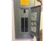 Image of the electrical panel displaying circuit breakers, wiring, and labels for home electrical system at 34 Misty Meadow Ln, Mulberry, FL 33860