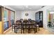 Spacious dining room with large windows and seating for eight at 34 Misty Meadow Ln, Mulberry, FL 33860
