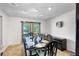 Elegant dining room featuring a modern light fixture and windows providing ample natural light at 34 Misty Meadow Ln, Mulberry, FL 33860