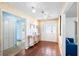 A spacious foyer with tiled floors, decorative mirror and access to other rooms at 34 Misty Meadow Ln, Mulberry, FL 33860