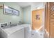 A laundry room with a washer and dryer and an inspirational quote on the wall at 34 Misty Meadow Ln, Mulberry, FL 33860