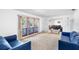 Spacious living room with large windows providing ample natural light at 34 Misty Meadow Ln, Mulberry, FL 33860