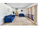 Cozy living room with plush carpet, natural light and serene decor at 34 Misty Meadow Ln, Mulberry, FL 33860