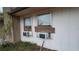 View of two windows with air conditioning units and a plant at 4202 Sunny View Dr, Lakeland, FL 33813