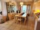 Dining room showcases table, ornate cabinet, beautiful lighting, and neutral walls at 4613 Eaglet Ln, Kissimmee, FL 34746