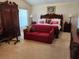 Spacious primary bedroom featuring a traditional-style furniture set and warm, inviting colors at 4613 Eaglet Ln, Kissimmee, FL 34746
