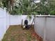 Enclosed backyard showing an above-ground pool with white fencing and pool equipment at 4814 Myrtle View N Dr, Mulberry, FL 33860
