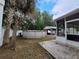 Backyard featuring an above ground pool, shed and screened in porch at 4814 Myrtle View N Dr, Mulberry, FL 33860