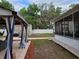 Spacious backyard featuring a screened porch and a covered patio perfect for outdoor entertaining at 4814 Myrtle View N Dr, Mulberry, FL 33860