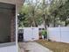 Fenced backyard with a gate leading to the property, offering privacy at 4814 Myrtle View N Dr, Mulberry, FL 33860
