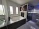 Modern bathroom featuring a soaking tub with stone accents and sleek fixtures at 4814 Myrtle View N Dr, Mulberry, FL 33860