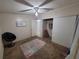 Bedroom features carpet, ceiling fan, and a sliding-door closet at 4814 Myrtle View N Dr, Mulberry, FL 33860