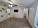 Bedroom features carpet, ceiling fan, and two doorways to closets at 4814 Myrtle View N Dr, Mulberry, FL 33860