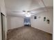 Simple bedroom with ceiling fan, carpeted floors, and basic decorations at 4814 Myrtle View N Dr, Mulberry, FL 33860