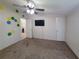 Bedroom with ceiling fan and two closet doors at 4814 Myrtle View N Dr, Mulberry, FL 33860