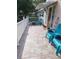 Spacious front porch with tiled flooring and comfortable seating, perfect for relaxing outdoors at 4814 Myrtle View N Dr, Mulberry, FL 33860