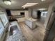 Spacious kitchen with island, granite counters, stainless sink, and ample storage at 4814 Myrtle View N Dr, Mulberry, FL 33860