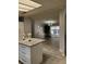 Open concept kitchen with granite island and view of dining area at 4814 Myrtle View N Dr, Mulberry, FL 33860
