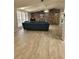 Living room featuring vaulted ceiling and wood-look accent wall at 4814 Myrtle View N Dr, Mulberry, FL 33860