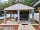 Covered outdoor living space featuring comfortable seating, perfect for relaxing and entertaining guests at 4814 Myrtle View N Dr, Mulberry, FL 33860