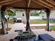 Covered patio with lighting, a coffee table, and views of the backyard and surrounding property at 4814 Myrtle View N Dr, Mulberry, FL 33860