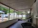 Spacious screened porch offering a view of the backyard, perfect for relaxing and enjoying the outdoors at 4814 Myrtle View N Dr, Mulberry, FL 33860