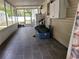 Large screened-in porch featuring tile flooring, ample space, and backyard access, ideal for relaxing and entertaining at 4814 Myrtle View N Dr, Mulberry, FL 33860