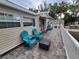 Inviting porch with seating, stylish tile flooring, and white railings, perfect for relaxing outdoors at 4814 Myrtle View N Dr, Mulberry, FL 33860