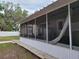 Enclosed porch providing outdoor living space with screened-in views at 4814 Myrtle View N Dr, Mulberry, FL 33860