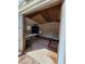 Interior view of the shed, featuring table, chairs, sofa, and bare plywood floor at 4814 Myrtle View N Dr, Mulberry, FL 33860