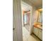 Bathroom area showcasing a walk-in shower and vanity with bright light at 511 Hawthorne Blvd, Leesburg, FL 34748