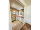 Bright bathroom with dual sinks, tiled flooring, and a shower stall at 511 Hawthorne Blvd, Leesburg, FL 34748
