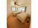 Bright bedroom featuring two twin beds, neutral walls, and large windows at 511 Hawthorne Blvd, Leesburg, FL 34748