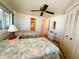 Bright bedroom features two twin beds and access to the ensuite bathroom at 511 Hawthorne Blvd, Leesburg, FL 34748