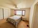 Bright bedroom featuring carpet flooring and a large window with a nice view at 511 Hawthorne Blvd, Leesburg, FL 34748
