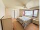 Bedroom featuring carpet, bright windows, neutral colors, and closet storage at 511 Hawthorne Blvd, Leesburg, FL 34748
