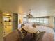 Open-concept dining area with views into the kitchen and living room at 511 Hawthorne Blvd, Leesburg, FL 34748