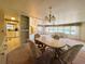 Open-concept dining area with a view of the kitchen and living room, perfect for entertaining at 511 Hawthorne Blvd, Leesburg, FL 34748