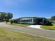 Single-story home with carport offering a cozy appeal and convenient parking at 511 Hawthorne Blvd, Leesburg, FL 34748