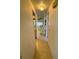 Hallway view leading to rooms with neutral walls and tile flooring at 511 Hawthorne Blvd, Leesburg, FL 34748