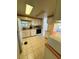 Bright kitchen showcases tile floors and functional appliances at 511 Hawthorne Blvd, Leesburg, FL 34748