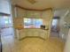 Kitchen view with tile flooring and cabinetry at 511 Hawthorne Blvd, Leesburg, FL 34748
