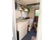 Efficient laundry room featuring a washer, dryer, and ample storage shelves at 511 Hawthorne Blvd, Leesburg, FL 34748