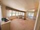 Inviting living room featuring large windows and a comfortable sofa at 511 Hawthorne Blvd, Leesburg, FL 34748
