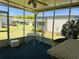 Enjoy outdoor living in this screened-in patio with ceiling fan at 511 Hawthorne Blvd, Leesburg, FL 34748
