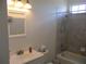 Bathroom area with a vanity, mirror, toilet, and shower at 7157 Hazeltine Cir, Lakeland, FL 33810