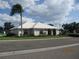 Charming single-story home boasts a well-maintained lawn and beautiful landscaping at 7157 Hazeltine Cir, Lakeland, FL 33810