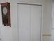 Hallway with closet, with a decorative clock adding a touch of charm at 7157 Hazeltine Cir, Lakeland, FL 33810