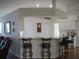 Open kitchen with breakfast bar and seating, neutral countertops, and ample cabinet space at 7157 Hazeltine Cir, Lakeland, FL 33810